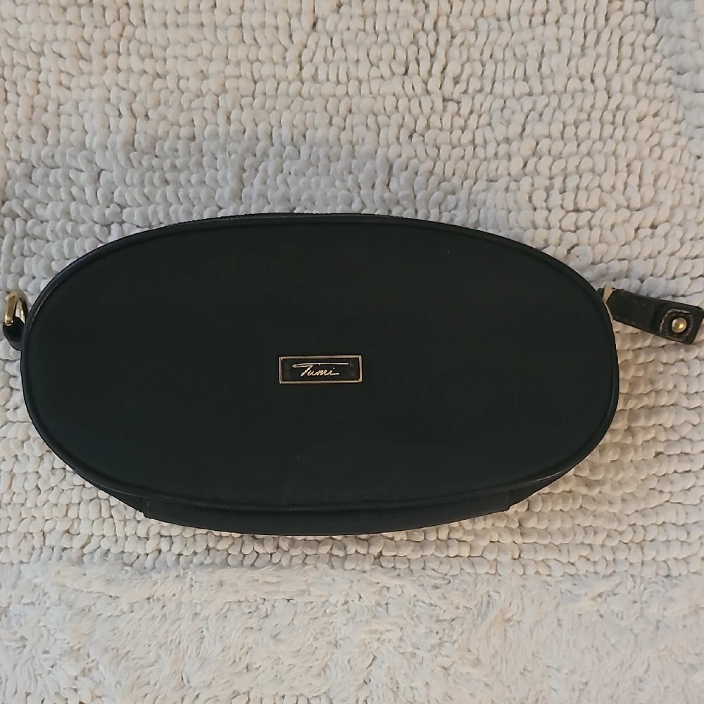 Tumi Black Oval Pouch with Gold Accent